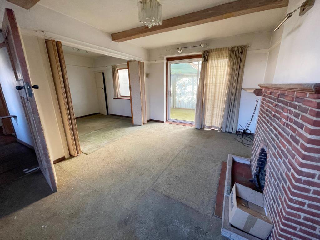 Lot: 9 - DETACHED BUNGALOW FOR IMPROVEMENT - Living Room with fireplace Dining Area and conservatory